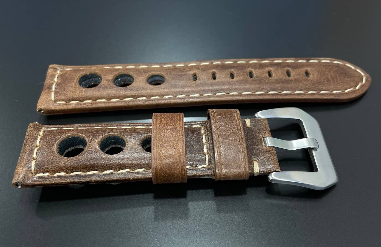 Strap. Brown leather band.