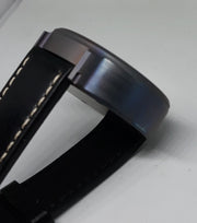 Strap. Black leather band.